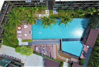 an overhead view of a swimming pool in a building at Pixel Condo - Panwa Beach in Ban Ao Makham