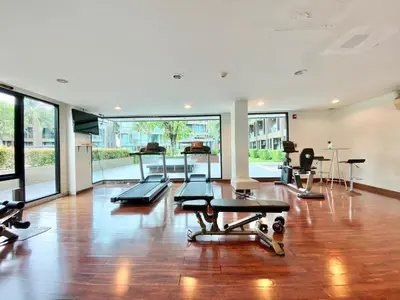 an empty gym with a lot of exercise equipment at Pixel Condo - Panwa Beach in Ban Ao Makham
