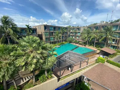 an overhead view of a swimming pool in a building at Pixel Condo - Panwa Beach in Ban Ao Makham