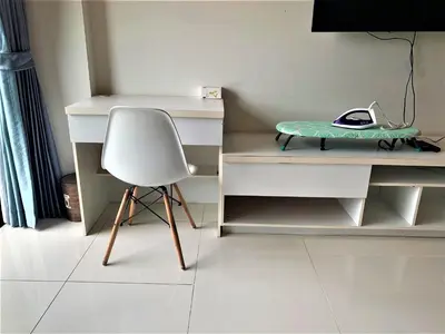 a white desk and a chair in a room at Pixel Condo - Panwa Beach in Ban Ao Makham