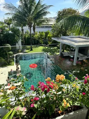 a pool with a table and a frisbee in it at Villa Jasmine - luxury private villa Bangtao Beach in Bang Tao Beach