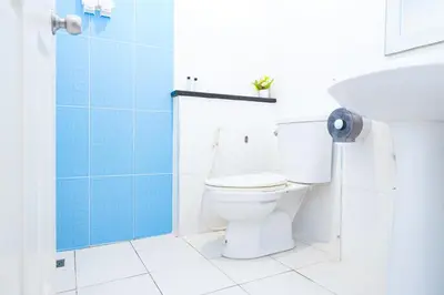 a bathroom with a toilet and a sink at Guesthouse Phuket Airport in Ban Bo Han