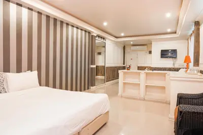 a large bedroom with a bed and a kitchen at Guesthouse Phuket Airport in Ban Bo Han