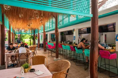 a restaurant with people sitting at tables at Nomads Ao Nang Party Hostel 18-35 Years Old Only in Ao Nang Beach