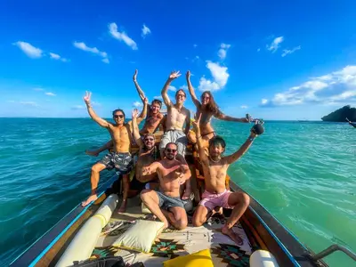 a group of people on a boat in the water at Nomads Ao Nang Party Hostel 18-35 Years Old Only in Ao Nang Beach