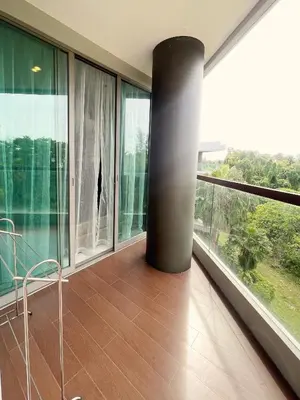a balcony with a pole in a room with windows at The Regent Bangtao Apartments in Bang Tao Beach