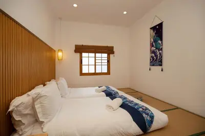 a large white bed in a room with a window at Villa Sunrise Garden B191 in Thalang