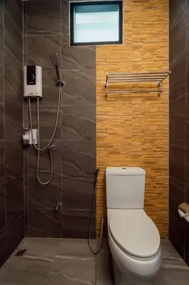 a bathroom with a toilet and a shower at Terminal 58 Airport in Ban Mut Dok Khao