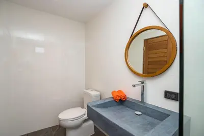 a bathroom with a sink and a mirror at New & Elegant 5Br Pool Villa Samakki Garden 5 in Rawai Beach