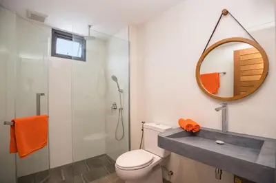 a bathroom with a toilet and a mirror at New & Elegant 5Br Pool Villa Samakki Garden 5 in Rawai Beach