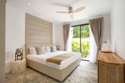 a bedroom with a bed and a large window at New & Elegant 5Br Pool Villa Samakki Garden 5 in Rawai Beach