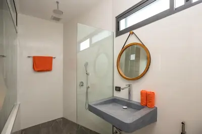 a bathroom with a sink and a mirror at New & Elegant 5Br Pool Villa Samakki Garden 5 in Rawai Beach