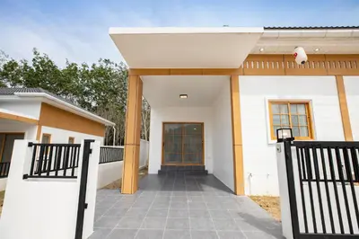 a house with a walkway leading to a door at Villa Sunrise Garden A181 in Thalang