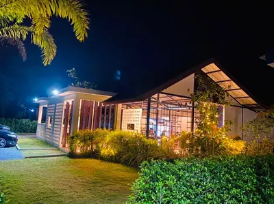 a house at night with its lights on at Blue Ba You Resort in Ban Khlong Haeng