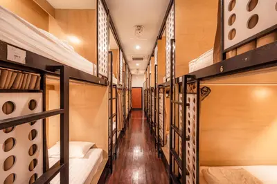 a row of bunk beds in a dorm room at The Dorm Hostel in Ban Lo Long