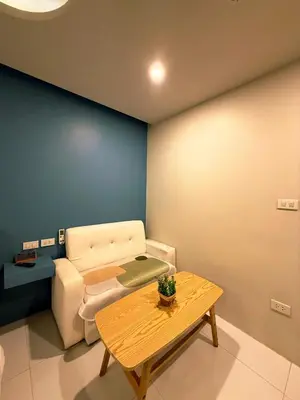 a living room with a couch and a table at THE NICE in Patong Beach