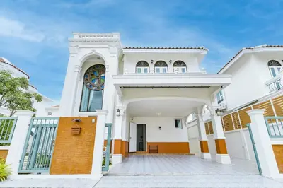 a large white house with a large entrance at Phuket's unique Sino-style villa with private pool in Ban Bang Khu