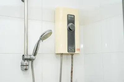 a shower with a shower head on a wall at ฺBaan Waru seaview villa in Kata Beach