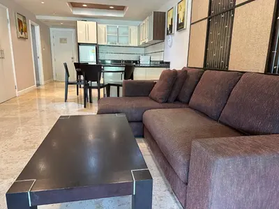 a living room with a couch and a table at Bel Air Cape Panwa resort apartment in south Phuket with pool access ,near Ao Yon in Phuket Town