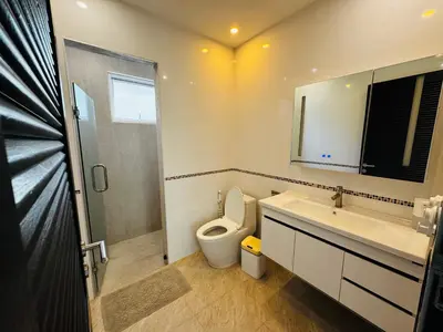 a bathroom with a toilet and a sink and a shower at Seaview Prima Villa Karon beach in Karon Beach
