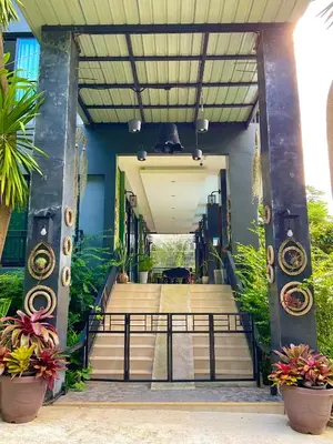 a stairway leading to a building with plants at Sea Smile Green View Pool Villa KRABI Klong Muang in Klong Muang Beach