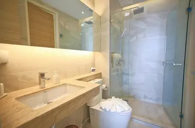 a bathroom with a sink and a shower and a toilet at CORNER SEA VIEW KRABI Ao Nang 4 STARS HOTEL RESIDENCE in Ao Nang Beach