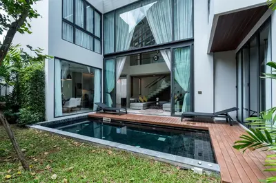 an external view of a house with a swimming pool at Panora villa by VillaCarte in Surin Beach