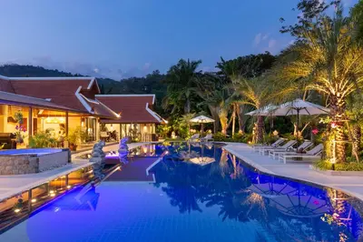 an image of a resort pool at night at Villa Carlos, Luxury 7 BDR Private Pool Villa, Baan Bua Nai Harn, Phuket in Rawai Beach