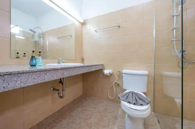 a bathroom with a toilet and a sink and a shower at Jungceylon Villa - quiet location, pool, maid in Patong Beach