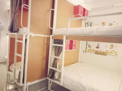 a couple of bunk beds in a room at Phuketnumnoi23 in Surin Beach