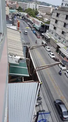 an overhead view of a city street with cars on the road at Southern Comfort Patong in Patong Beach
