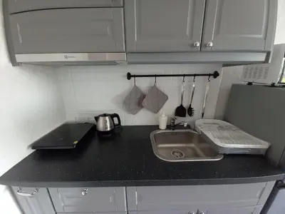 a kitchen counter with a sink and a refrigerator at В7 НОВАЯ КВАРТИРА ВАТСАП669З582I976 можно РУБЛЯМИ in Nai Yang Beach