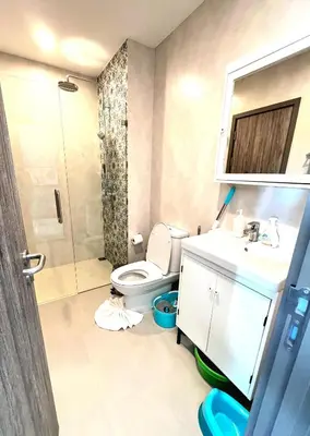 a bathroom with a toilet and a shower and a sink at В7 НОВАЯ КВАРТИРА ВАТСАП669З582I976 можно РУБЛЯМИ in Nai Yang Beach