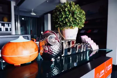 a counter with a potted plant on top of it at Ratana Residence Thalang in Thalang