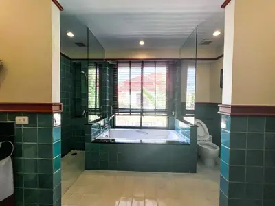 a large bathroom with a tub and a toilet at 3-4BR Laguna Phuket Golf Course Villa with Pool & Jacuzzi in Laguna Phuket