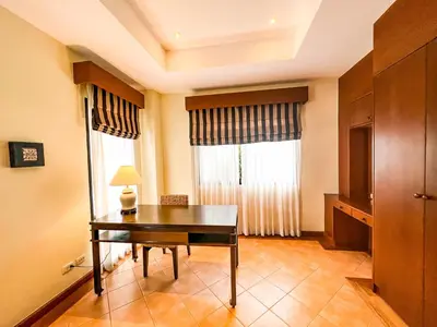 a room with a desk and a window at 3-4BR Laguna Phuket Golf Course Villa with Pool & Jacuzzi in Laguna Phuket