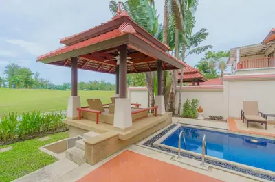 a pool with a gazebo next to a house at 3-4BR Laguna Phuket Golf Course Villa with Pool & Jacuzzi in Laguna Phuket