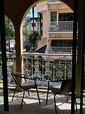 a couple of chairs sitting on a balcony at Grand Orlov Apart Hotel in Patong Beach