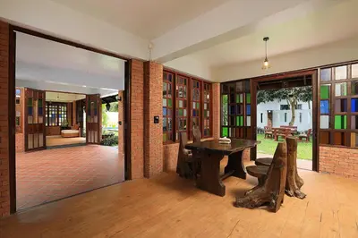 a room with a wooden table and some books at WoLin Lemon Resort in Ban Saiyuan (1)