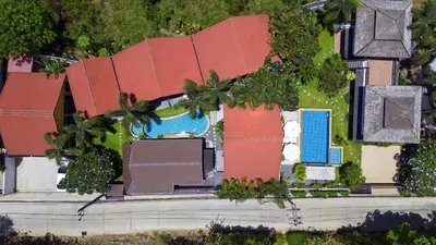 an overhead view of a house with palm trees at WoLin Lemon Resort in Ban Saiyuan (1)