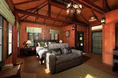 a living room with a bed and a couch at WoLin Lemon Resort in Ban Saiyuan (1)