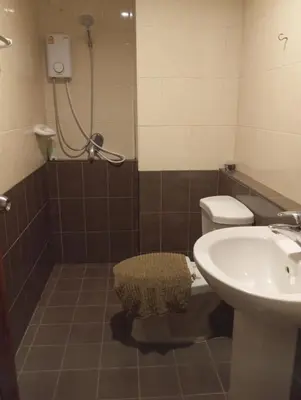 a bathroom with a shower and a toilet and a sink at Baan7984 Rawai in Rawai Beach