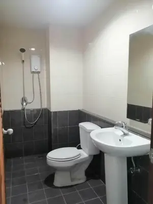 a bathroom with a toilet and a sink at Baan7984 Rawai in Rawai Beach
