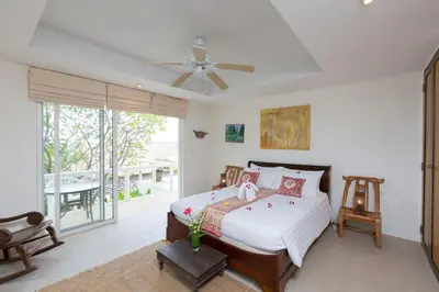 a bedroom with a bed and a ceiling fan at Katamanda villa Moon 3 Bed seaview near Kata Beach in Kata Beach