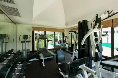 a gym with a bunch of treadmills and machines at Katamanda villa Moon 3 Bed seaview near Kata Beach in Kata Beach