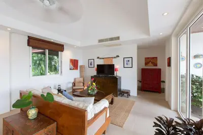 a living room with a couch and a tv at Katamanda villa Moon 3 Bed seaview near Kata Beach in Kata Beach