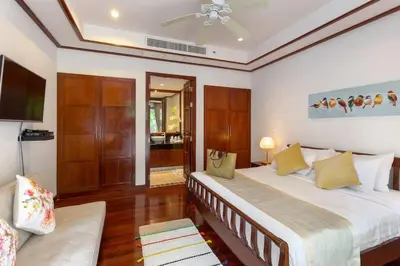 a bedroom with two beds and a ceiling fan at Katamanda 3 Bed Tropical Villa B3 Near Kata Beach in Kata Beach
