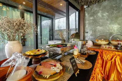 a buffet with a lot of food on a table at Malabar Pool Villa Phuket in Phuket Town