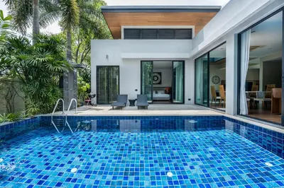 a pool in the backyard of a villa at Baan Bua BT17 by Villacarte in Nai Harn Beach