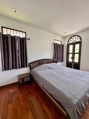 a bedroom with a large bed and a window at 103/24 Kathu Waterfall in Phuket Town
